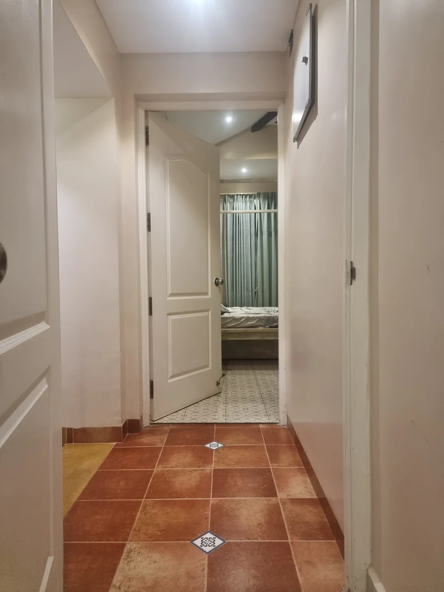 An interior hallway with patterned flooring