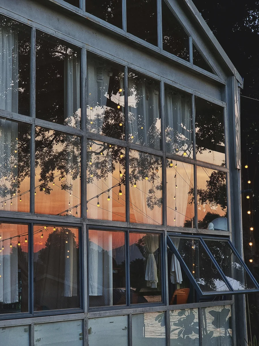 Sunset reflected in a wall of glass windows