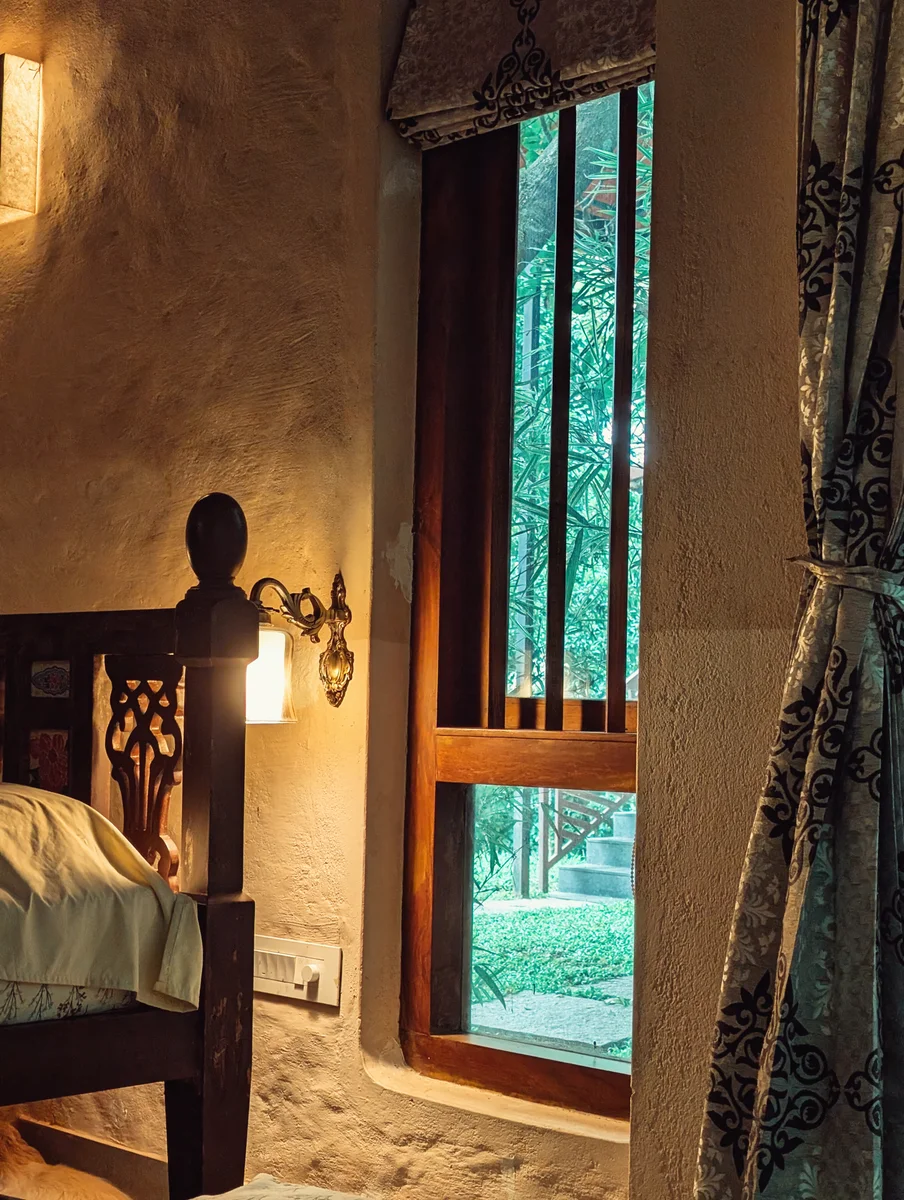 Warm bedroom light beside an open green doorway