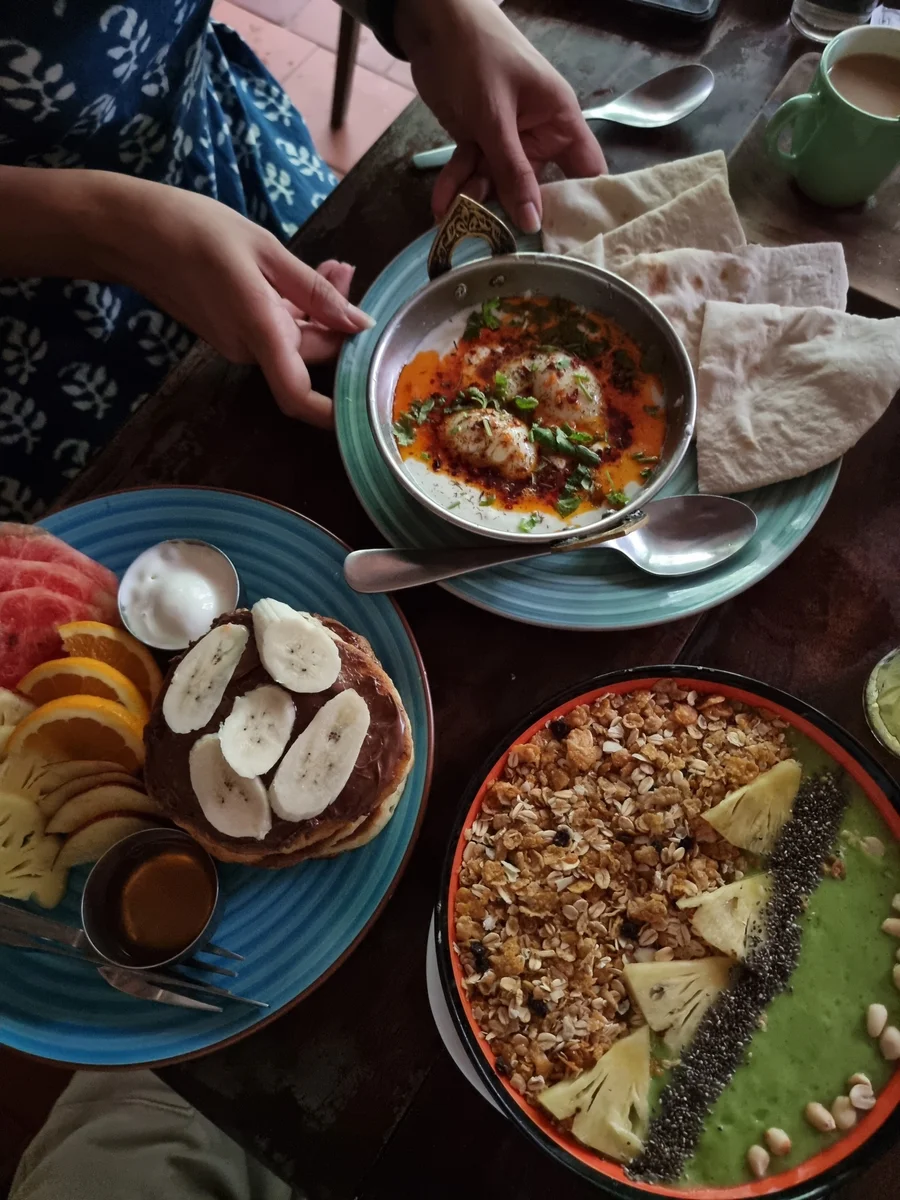 A shared meal with colourful plates of food